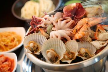 Steamed seafood dish with steaming and fresh seafood 김이 모락모락 나고신선한 해산물이 들어가 있는 해산물찜 요리