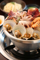Steamed seafood dish with steaming and fresh seafood 김이 모락모락 나고신선한 해산물이 들어가 있는 해산물찜 요리