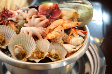 Steamed seafood dish with steaming and fresh seafood 김이 모락모락 나고신선한 해산물이 들어가 있는 해산물찜 요리