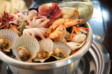 Steamed seafood dish with steaming and fresh seafood 김이 모락모락 나고신선한 해산물이 들어가 있는 해산물찜 요리