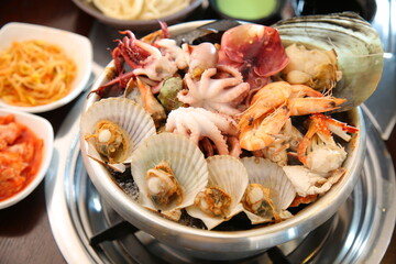 Steamed seafood dish with steaming and fresh seafood 김이 모락모락 나고신선한 해산물이 들어가 있는 해산물찜 요리