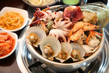 Steamed seafood dish with steaming and fresh seafood 김이 모락모락 나고신선한 해산물이 들어가 있는 해산물찜 요리
