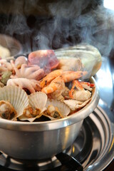 Steamed seafood dish with steaming and fresh seafood 김이 모락모락 나고신선한 해산물이 들어가 있는 해산물찜 요리