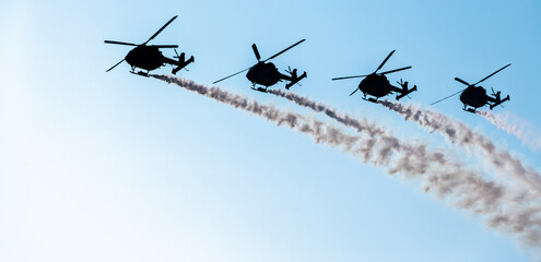 Indian Air Force Sarang helicopter air display team flying HAL Dhruv aircraft.