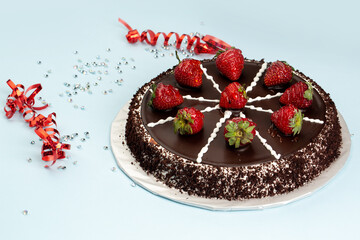 Chocolate cake with strawberries on top