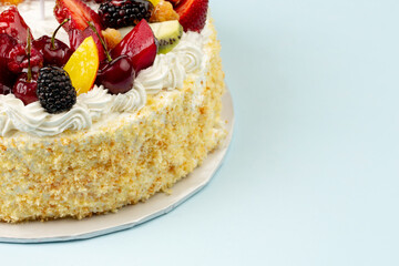 Birthday cakes with cream and fruits and candles 