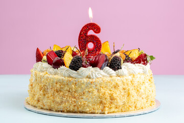 Birthday cakes with cream and fruits and candles 