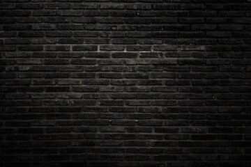 Fototapeta na wymiar The black wall surface uses a lot of bricks. Or old black brick wall abstract pattern. Put together beautifully dark background.
