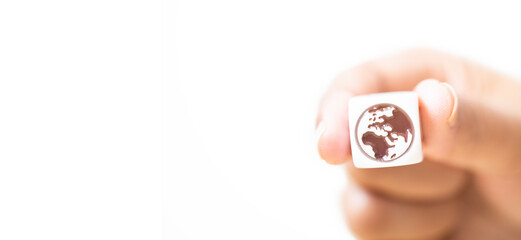 Fototapeta na wymiar The world in the hand with nature background.Hand holding dice cube with globe icon.environment earth day.green planet save the earth day concept.Atmosphere, Map, Worldwide business.Banner background.