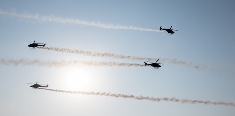 Indian Air Force Sarang helicopter air display team flying HAL Dhruv aircraft.