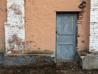 texture of an old brick wall with a door