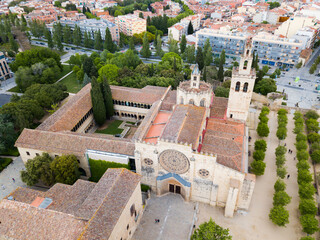 View from drone of ancient Benedictine abbey in Sant Cugat del Valles, Catalonia, Spain.
