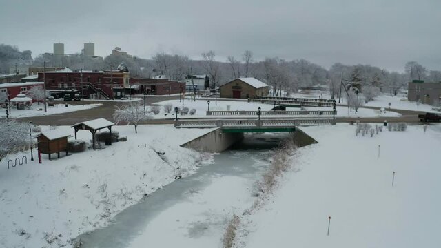 Tiny bridge over frozen river in small American county town