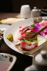 Chopsticks holding sashimi on a simple background  심플한 배경에 회를 집고있는 젓가락