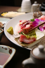 Chopsticks holding sashimi on a simple background  심플한 배경에 회를 집고있는 젓가락