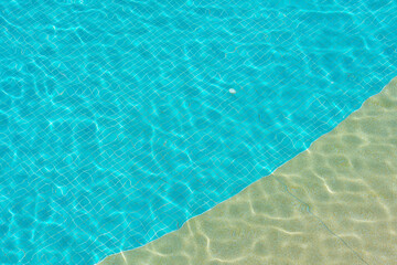 blue swimming pool with sunny reflections abstract for background