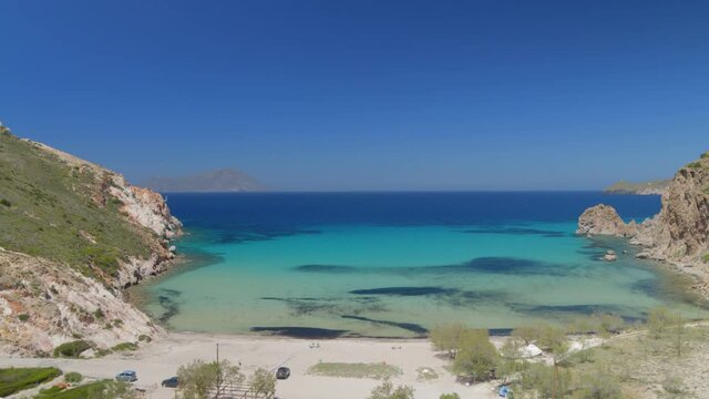 Forward Aerial of a Bay Surrounded by Cliffs on the Aegean Sea in Milos Greece