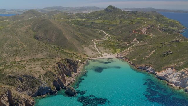 Aerial View of a Bay Surrounded by Cliffs on the Aegean Sea in Milos Greece