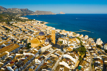 Fototapeta na wymiar Panoramic aerial view of Altea city by Mediterranean coast overlooking blue and white domes of Church of Our Lady of Solace, Spain..