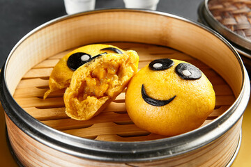 Closed bao bun with mango inside. Delicious chinese steamed sweet food. Chinese, asian, authentic food concept