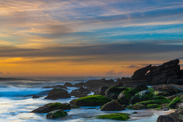 Fototapeta na wymiar Pastels - high cloud sunrise seascape