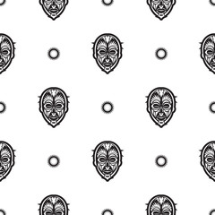 Seamless pattern with tiki mask or totem. Patterns in the style of Polynesia. Good for prints, textiles and backgrounds. Isolated. Vector illustration.