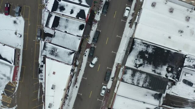 Top down ascending view of small American county town in winter season