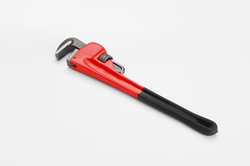Plumbing wrench on white background