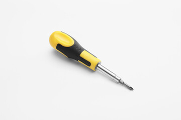 Fototapeta premium Yellow and black multi-bit screwdriver with interchangeable tips for home repair and DIY projects, this versatile hand tool is essential for home repair, DIY projects