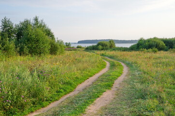 Fototapeta na wymiar Evening view of the road leading to Lake Seliger, Tver region, Russia