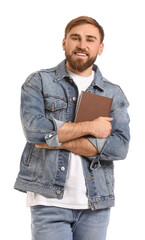 Young man with book on white background