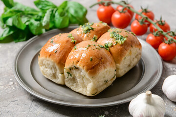 Composition with fresh bread and garlic on grey background