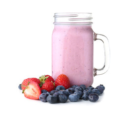 Mason jar of tasty berry smoothie on white background