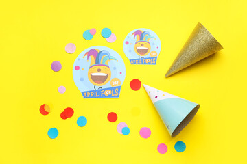 Party decor for April Fools Day on color background