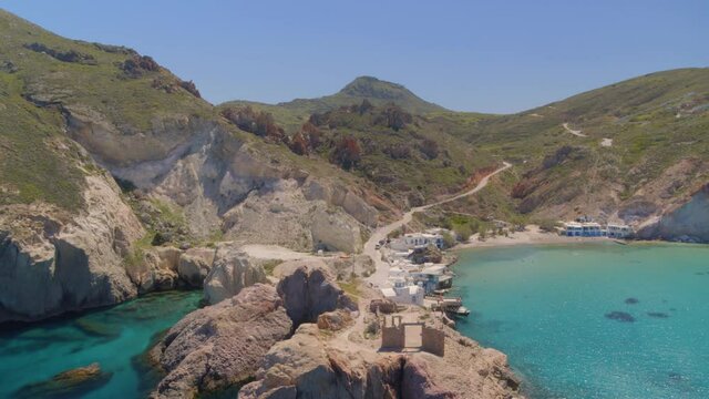 Flying Towards a Bay Surrounded by Cliffs on the Aegean Sea in Cyclades Milos