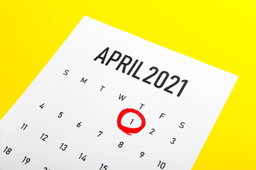 Calendar with marked date of April Fool's Day on color background