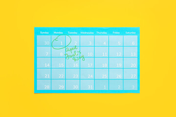 Calendar with marked date of April Fool's Day on color background