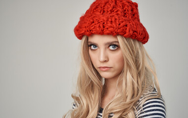 looking sexy blondes in red knitted hat and striped t-shirt cropped view close-up