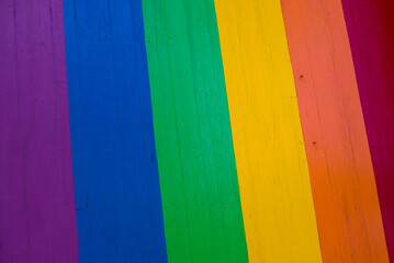 Background of grungy old wood planks in rainbow colors, gay pride symbol