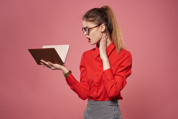 Woman in red shirt notepad documents secretary professionals