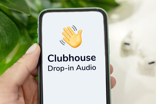 Open App Clubhouse And Wireless Headphones