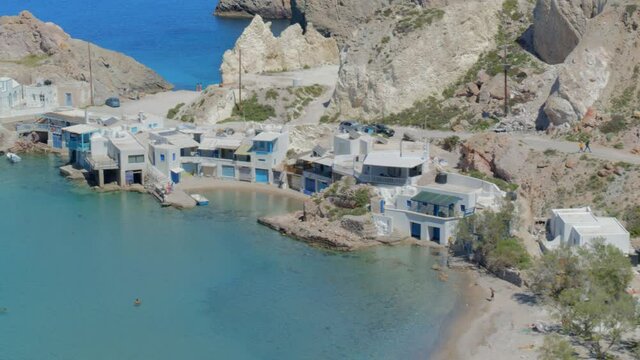 Aerial Pan of a Fishing Village on the Blue Aegean Sea in Cyclades Milos Greece