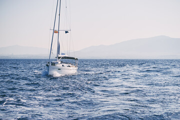 Fototapeta premium Beautiful white yaht sailing the sea.