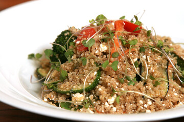 Quinoa salad with vegetables mix, chickpea and cheese.Superfoods concept.