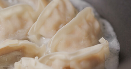 Grilling japanese dumpling on fry pan