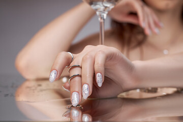 Beautiful manicure on the nails of a woman. Color coloring of the nails on the hand. Gentle,...