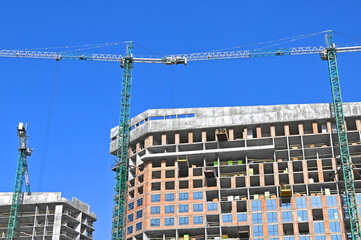 Crane and highrise construction site