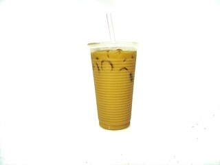 Nescafe ice in plastic glass with straw isolated on white blurry background.