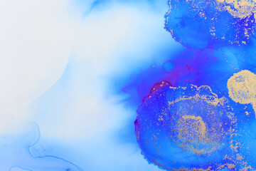 art photography of abstract fluid art painting with alcohol ink, blue and gold colors