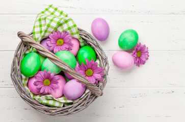 Easter greeting card with colorful easter eggs and flowers